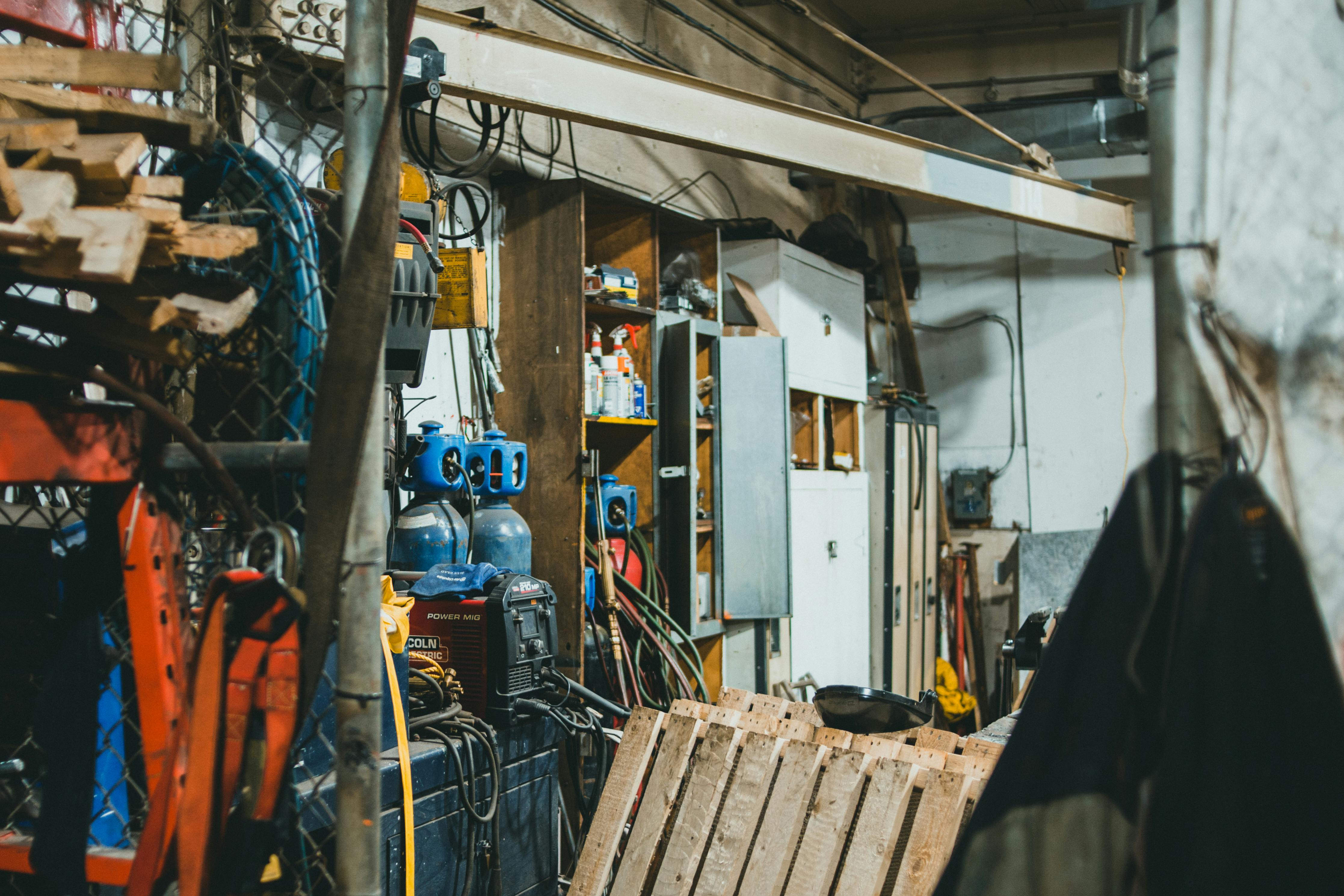 Workshop with tools and cables representing supply chain and parts management