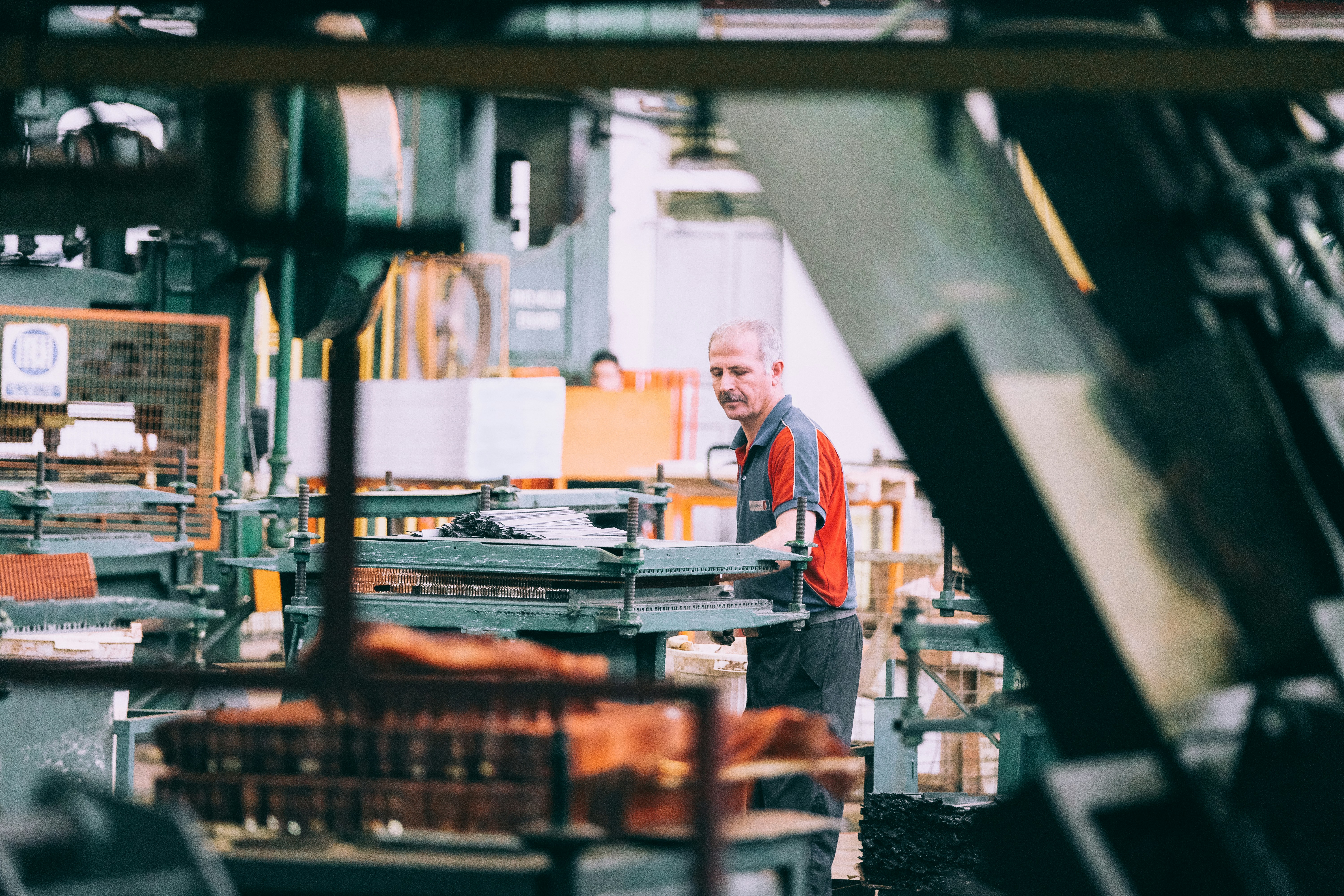 Factory worker handling parts on a production line